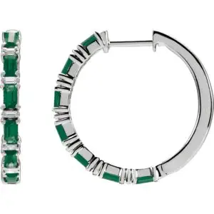 Pair of 14k white gold emerald baguette hoop earrings, measuring 2 mm thick, with fourteen GIA Type II Clarity AA, baguette cut emeralds. The emeralds have an approximate total weight of 1.26 carats, and are prong set. In addition, there are twelve baguette diamonds, G-H color, I1 clarity, with a total weight of 1.25 carats. The earrings weigh approximately 4.35 grams.