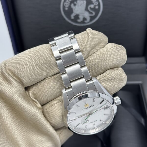 Side angle of Grand Seiko SBGA427 with focus on bracelet and case detail
