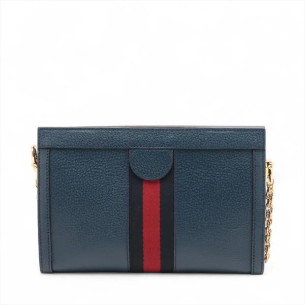 Textured dark blue leather rectangular clutch with a vertical black and red stripe down the center and gold chain accents on the sides