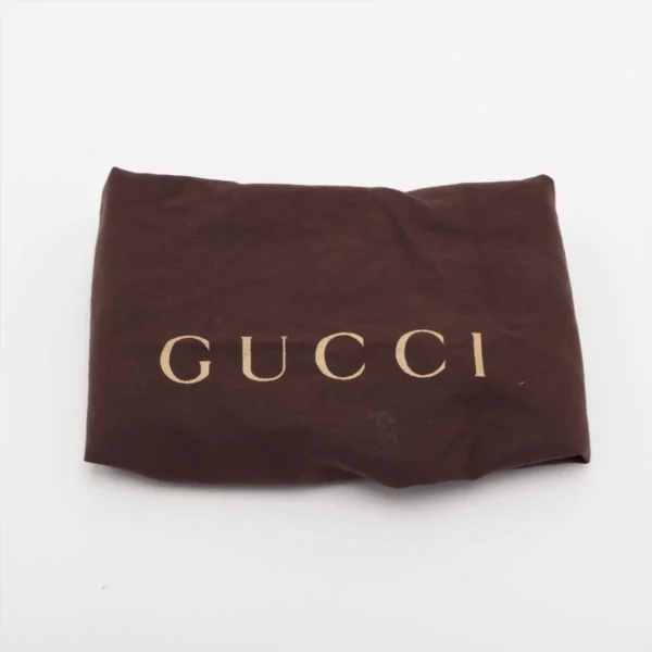 Brown fabric pouch with the word GUCCI printed in beige letters on a white background.
