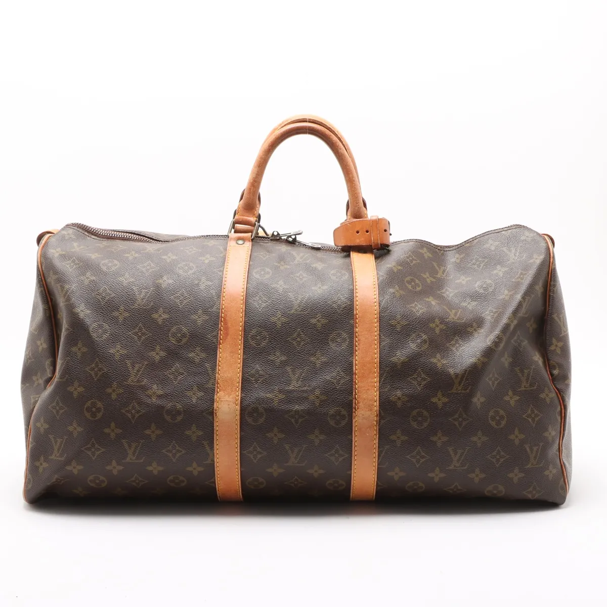 Brown Louis Vuitton monogram canvas duffle bag with tan leather handles and straps against a white background.