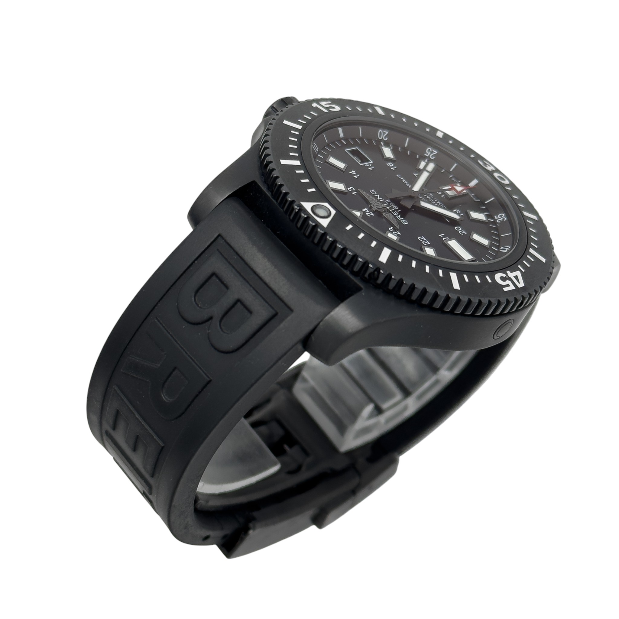 Black diver-style wristwatch with rotating bezel, bold white hour markers and thick rubber strap seen at an angle